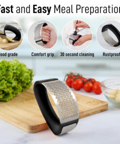 Hand pressing garlic with ergonomic stainless steel garlic crusher