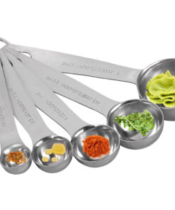 1 tablespoon stainless spoon filled with olive oil on a kitchen counter