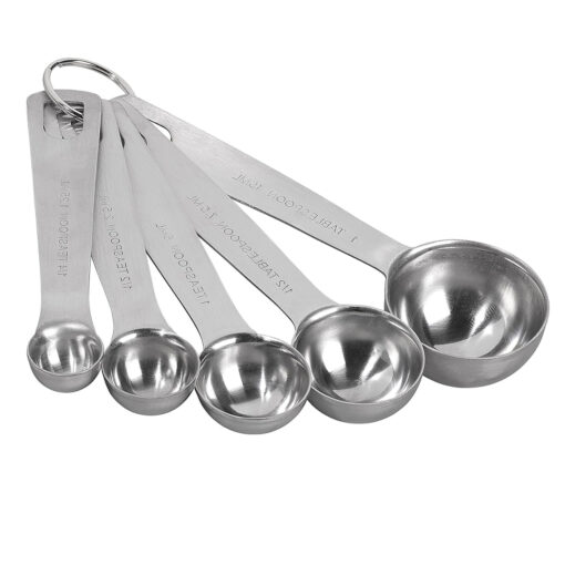 Stainless steel measuring spoon with 15ml capacity placed on white background